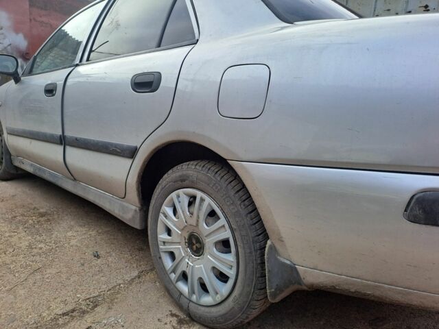 Серый Мицубиси Харизма, объемом двигателя 0 л и пробегом 333 тыс. км за 2700 $, фото 3 на Automoto.ua