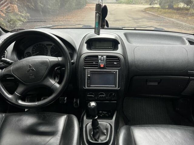 Сірий Міцубісі Харизма, об'ємом двигуна 1.6 л та пробігом 262 тис. км за 3700 $, фото 9 на Automoto.ua