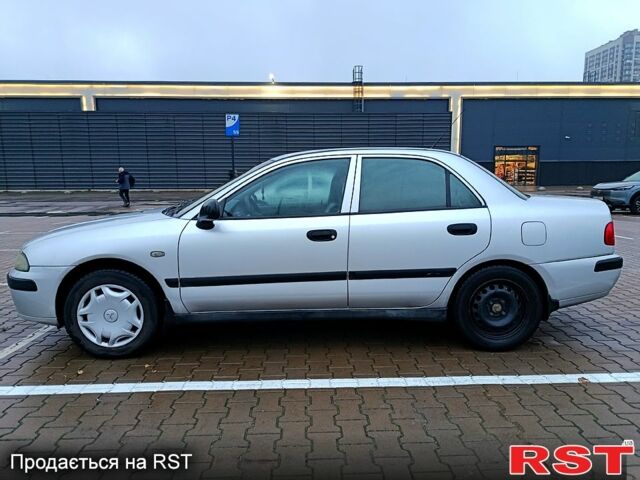 Серый Мицубиси Харизма, объемом двигателя 1.6 л и пробегом 212 тыс. км за 3700 $, фото 6 на Automoto.ua