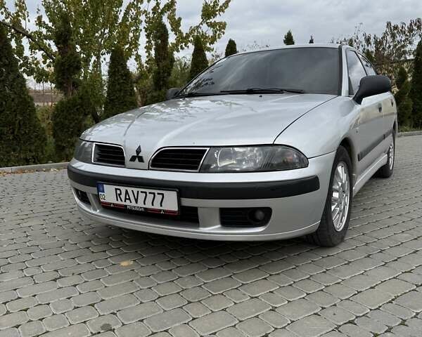 Сірий Міцубісі Харизма, об'ємом двигуна 1.83 л та пробігом 319 тис. км за 4500 $, фото 1 на Automoto.ua