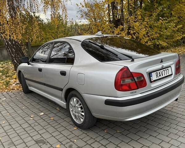 Сірий Міцубісі Харизма, об'ємом двигуна 1.83 л та пробігом 319 тис. км за 4500 $, фото 5 на Automoto.ua