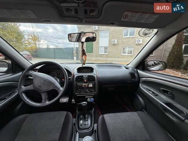 Сірий Міцубісі Харизма, об'ємом двигуна 1.83 л та пробігом 319 тис. км за 4500 $, фото 6 на Automoto.ua