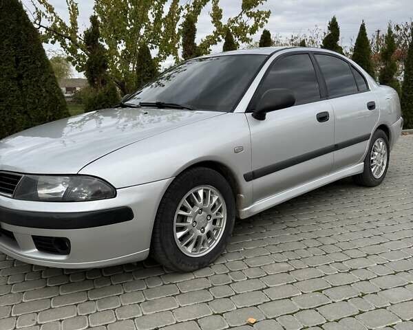 Сірий Міцубісі Харизма, об'ємом двигуна 1.83 л та пробігом 319 тис. км за 4500 $, фото 2 на Automoto.ua