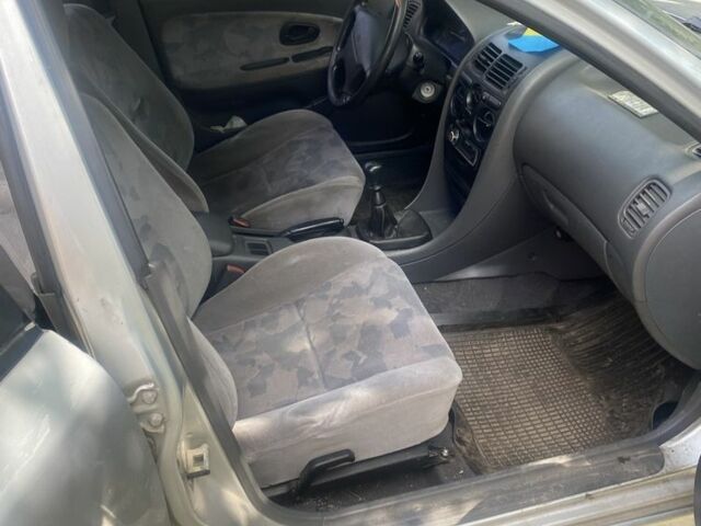 Серый Мицубиси Харизма, объемом двигателя 1.8 л и пробегом 202 тыс. км за 1100 $, фото 6 на Automoto.ua