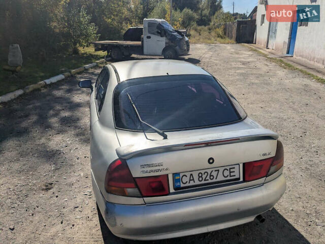 Серый Мицубиси Харизма, объемом двигателя 1.83 л и пробегом 415 тыс. км за 1999 $, фото 1 на Automoto.ua