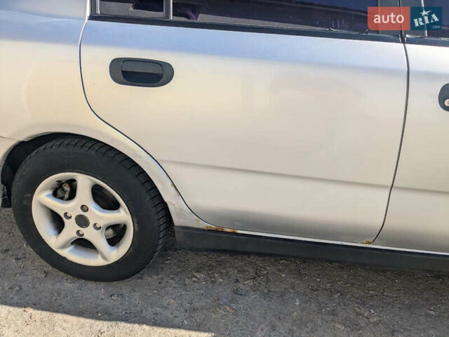 Серый Мицубиси Харизма, объемом двигателя 1.83 л и пробегом 415 тыс. км за 1999 $, фото 2 на Automoto.ua