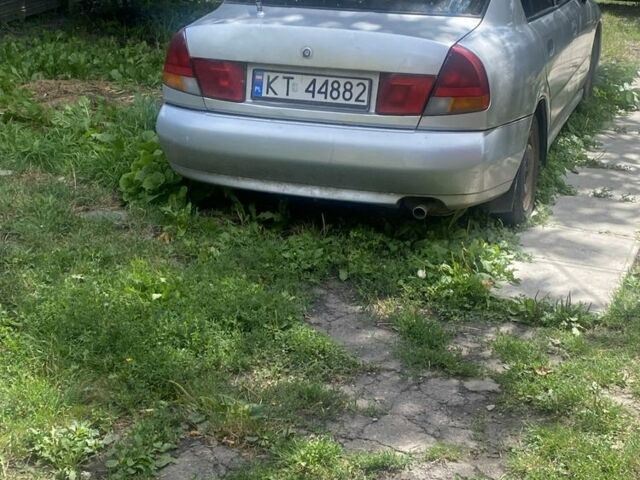 Серый Мицубиси Харизма, объемом двигателя 1.8 л и пробегом 202 тыс. км за 1100 $, фото 1 на Automoto.ua