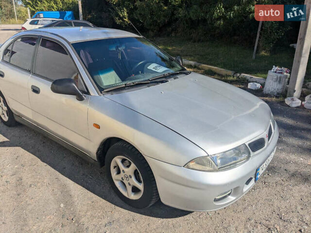 Серый Мицубиси Харизма, объемом двигателя 1.83 л и пробегом 415 тыс. км за 1999 $, фото 4 на Automoto.ua