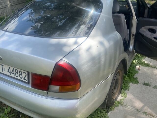 Серый Мицубиси Харизма, объемом двигателя 1.8 л и пробегом 202 тыс. км за 1100 $, фото 3 на Automoto.ua