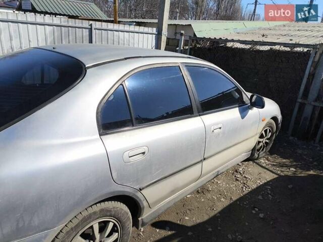 Сірий Міцубісі Харизма, об'ємом двигуна 1.8 л та пробігом 300 тис. км за 1800 $, фото 2 на Automoto.ua