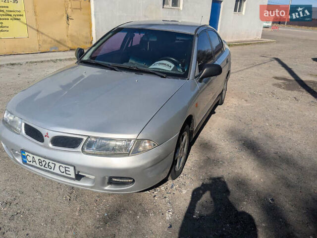 Серый Мицубиси Харизма, объемом двигателя 1.83 л и пробегом 415 тыс. км за 1999 $, фото 3 на Automoto.ua
