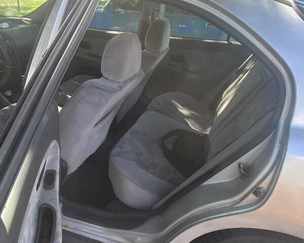 Сірий Міцубісі Харизма, об'ємом двигуна 1.83 л та пробігом 228 тис. км за 1500 $, фото 10 на Automoto.ua