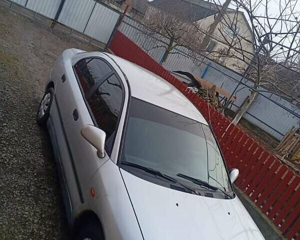 Серый Мицубиси Харизма, объемом двигателя 1.9 л и пробегом 65 тыс. км за 1650 $, фото 6 на Automoto.ua