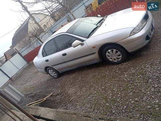 Серый Мицубиси Харизма, объемом двигателя 1.9 л и пробегом 65 тыс. км за 1650 $, фото 7 на Automoto.ua
