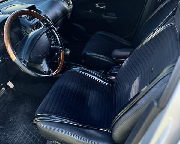 Сірий Міцубісі Харизма, об'ємом двигуна 1.83 л та пробігом 258 тис. км за 4200 $, фото 16 на Automoto.ua