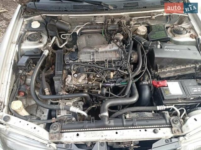 Серый Мицубиси Харизма, объемом двигателя 1.9 л и пробегом 65 тыс. км за 1650 $, фото 10 на Automoto.ua