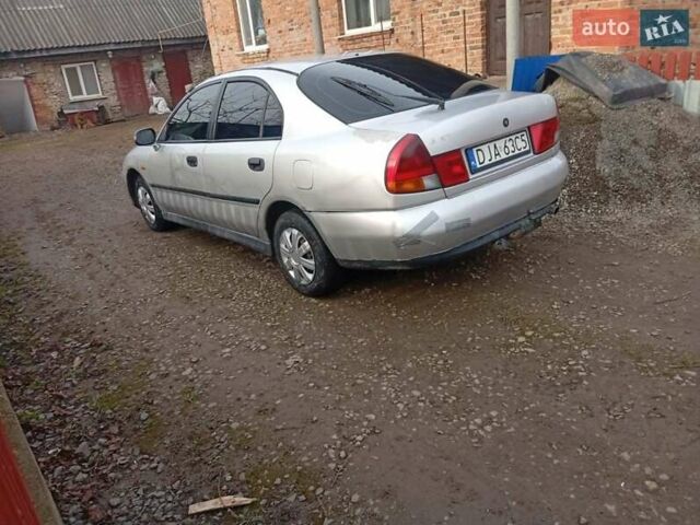 Серый Мицубиси Харизма, объемом двигателя 1.9 л и пробегом 65 тыс. км за 1650 $, фото 14 на Automoto.ua