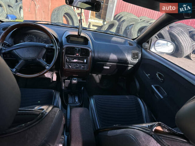 Сірий Міцубісі Харизма, об'ємом двигуна 1.83 л та пробігом 258 тис. км за 4200 $, фото 17 на Automoto.ua