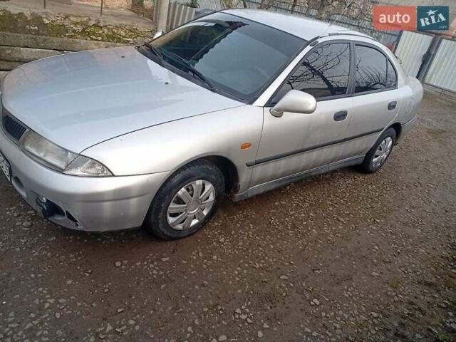 Серый Мицубиси Харизма, объемом двигателя 1.9 л и пробегом 65 тыс. км за 1650 $, фото 18 на Automoto.ua