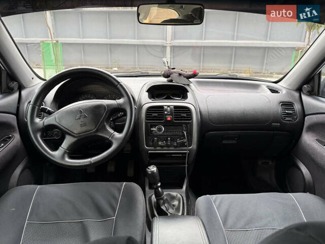 Сірий Міцубісі Харизма, об'ємом двигуна 1.6 л та пробігом 398 тис. км за 2500 $, фото 4 на Automoto.ua