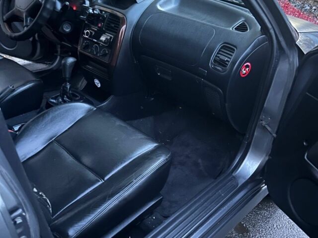 Серый Мицубиси Харизма, объемом двигателя 1.8 л и пробегом 377 тыс. км за 1182 $, фото 5 на Automoto.ua