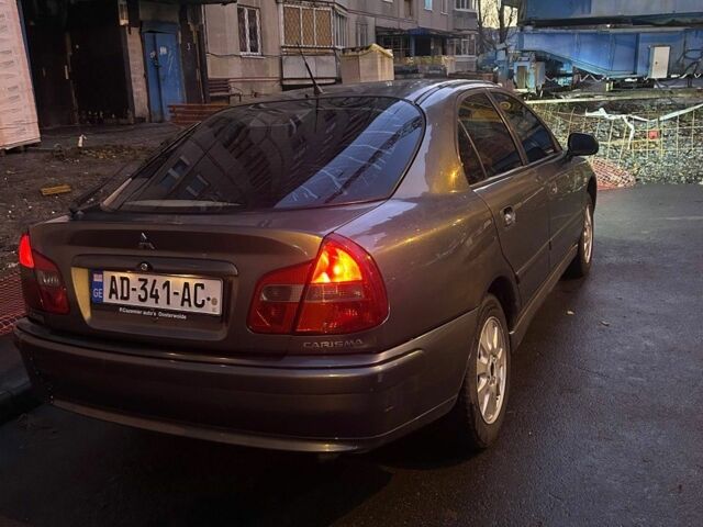 Серый Мицубиси Харизма, объемом двигателя 1.8 л и пробегом 377 тыс. км за 1182 $, фото 2 на Automoto.ua