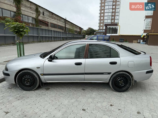 Сірий Міцубісі Харизма, об'ємом двигуна 1.6 л та пробігом 398 тис. км за 2500 $, фото 3 на Automoto.ua