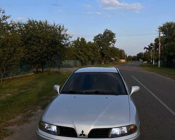 Сірий Міцубісі Харизма, об'ємом двигуна 1.6 л та пробігом 290 тис. км за 3900 $, фото 5 на Automoto.ua