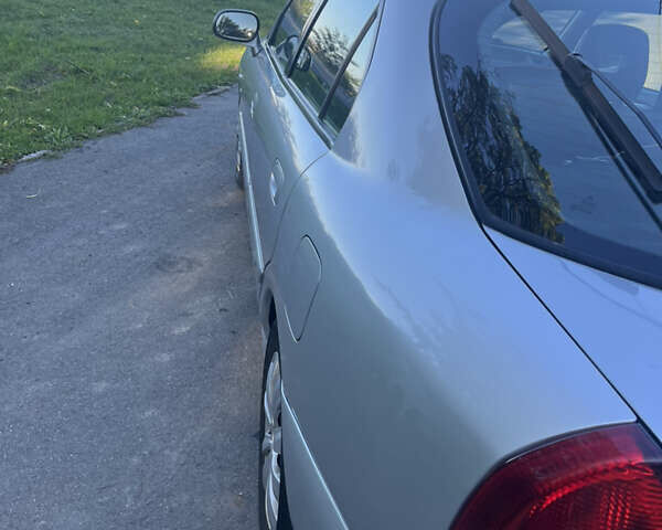 Серый Мицубиси Харизма, объемом двигателя 1.8 л и пробегом 214 тыс. км за 5650 $, фото 4 на Automoto.ua