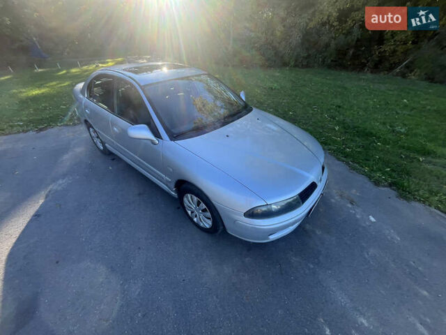 Серый Мицубиси Харизма, объемом двигателя 1.8 л и пробегом 214 тыс. км за 5650 $, фото 3 на Automoto.ua