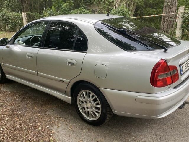 Серый Мицубиси Харизма, объемом двигателя 1.8 л и пробегом 265 тыс. км за 3500 $, фото 1 на Automoto.ua