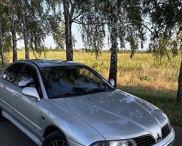 Сірий Міцубісі Харизма, об'ємом двигуна 1.6 л та пробігом 290 тис. км за 3900 $, фото 1 на Automoto.ua