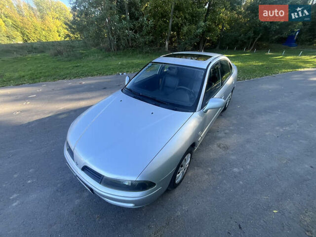 Серый Мицубиси Харизма, объемом двигателя 1.8 л и пробегом 214 тыс. км за 5650 $, фото 2 на Automoto.ua