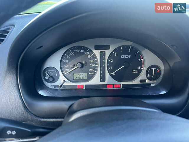 Серый Мицубиси Харизма, объемом двигателя 1.8 л и пробегом 214 тыс. км за 5650 $, фото 10 на Automoto.ua