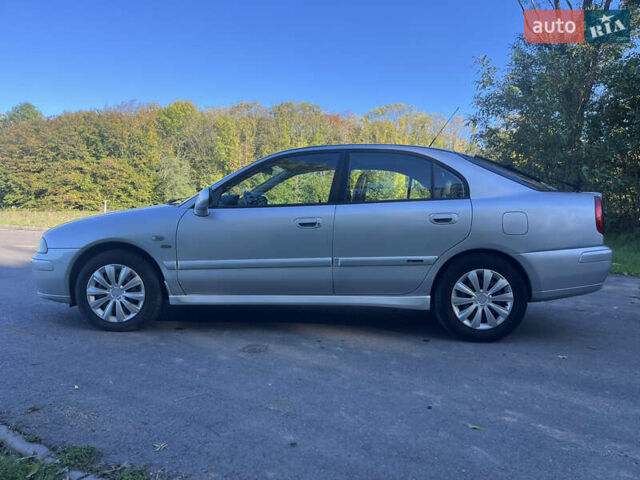 Серый Мицубиси Харизма, объемом двигателя 1.8 л и пробегом 214 тыс. км за 5650 $, фото 1 на Automoto.ua