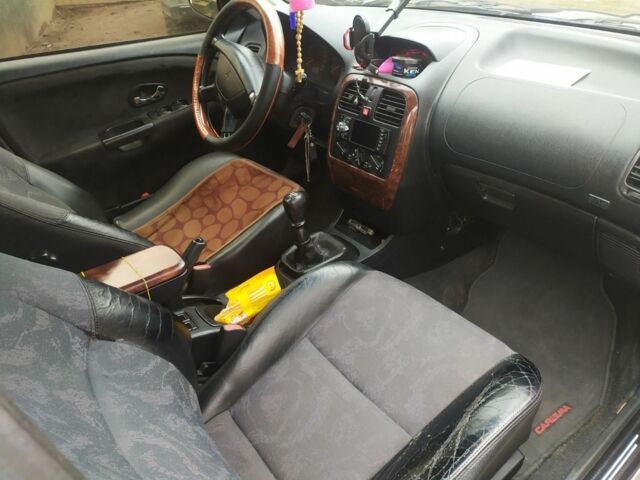 Серый Мицубиси Харизма, объемом двигателя 1.6 л и пробегом 330 тыс. км за 2800 $, фото 15 на Automoto.ua