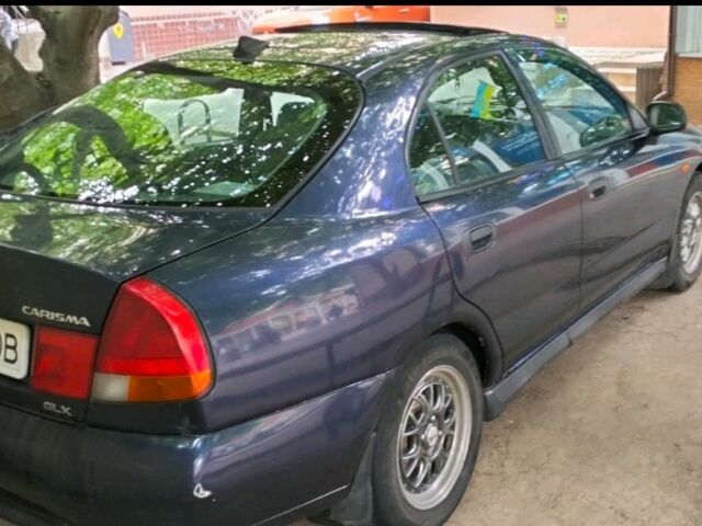 Синий Мицубиси Харизма, объемом двигателя 1.6 л и пробегом 375 тыс. км за 2250 $, фото 1 на Automoto.ua