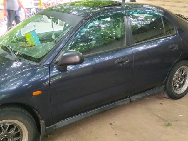 Синий Мицубиси Харизма, объемом двигателя 1.6 л и пробегом 375 тыс. км за 2250 $, фото 2 на Automoto.ua