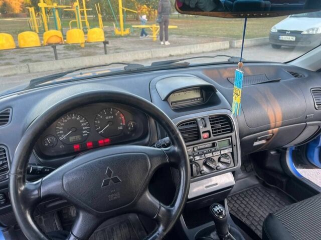 Синий Мицубиси Харизма, объемом двигателя 1.8 л и пробегом 240 тыс. км за 4000 $, фото 10 на Automoto.ua