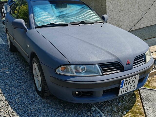 Синий Мицубиси Харизма, объемом двигателя 1.9 л и пробегом 300 тыс. км за 2576 $, фото 1 на Automoto.ua