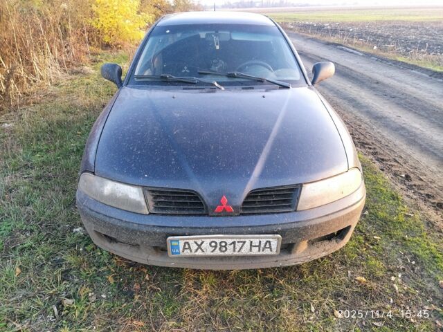 Синий Мицубиси Харизма, объемом двигателя 1.6 л и пробегом 300 тыс. км за 1800 $, фото 3 на Automoto.ua