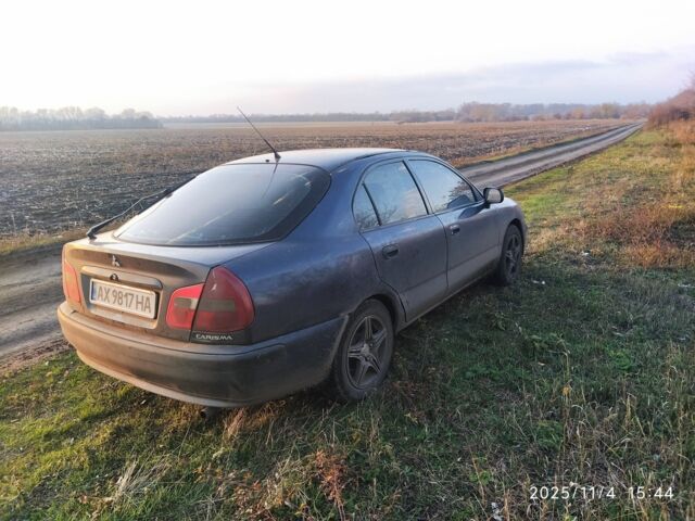 Синий Мицубиси Харизма, объемом двигателя 1.6 л и пробегом 300 тыс. км за 1800 $, фото 5 на Automoto.ua