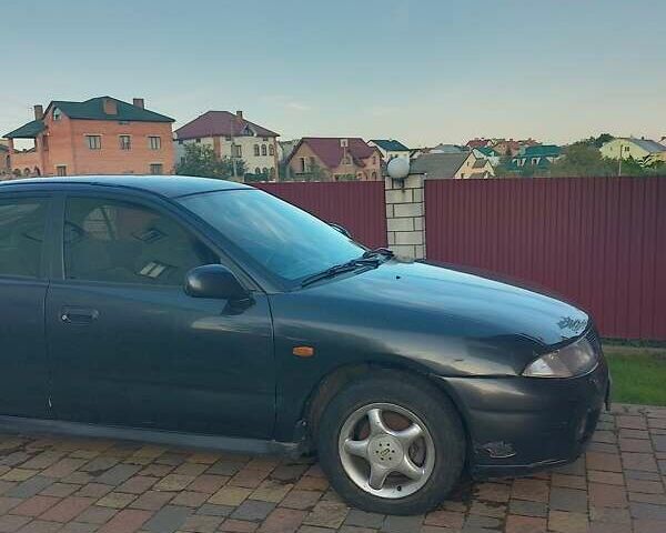 Синий Мицубиси Харизма, объемом двигателя 1.8 л и пробегом 276 тыс. км за 2400 $, фото 8 на Automoto.ua