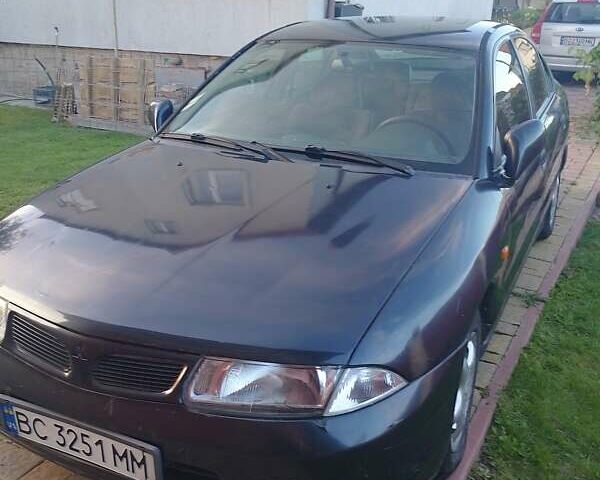 Синий Мицубиси Харизма, объемом двигателя 1.8 л и пробегом 276 тыс. км за 2400 $, фото 4 на Automoto.ua