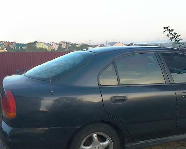 Синий Мицубиси Харизма, объемом двигателя 1.8 л и пробегом 276 тыс. км за 2400 $, фото 7 на Automoto.ua