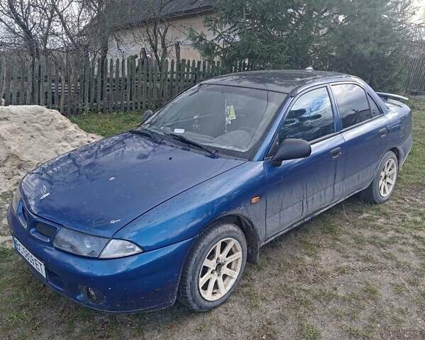 Синий Мицубиси Харизма, объемом двигателя 1.6 л и пробегом 380 тыс. км за 1900 $, фото 1 на Automoto.ua