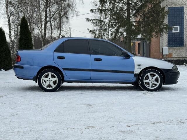 Синій Міцубісі Харизма, об'ємом двигуна 1.6 л та пробігом 300 тис. км за 1999 $, фото 6 на Automoto.ua