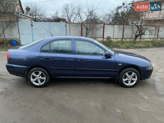 Синій Міцубісі Харизма, об'ємом двигуна 1.6 л та пробігом 170 тис. км за 3000 $, фото 9 на Automoto.ua