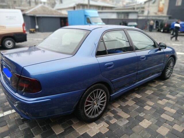 Синий Мицубиси Харизма, объемом двигателя 1.8 л и пробегом 305 тыс. км за 3999 $, фото 2 на Automoto.ua