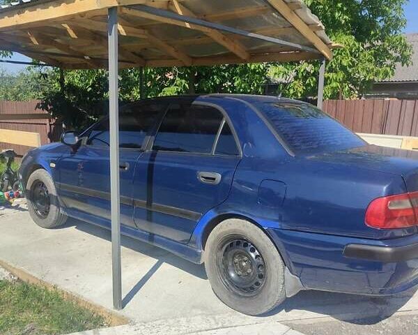 Синий Мицубиси Харизма, объемом двигателя 1.6 л и пробегом 270 тыс. км за 2300 $, фото 5 на Automoto.ua